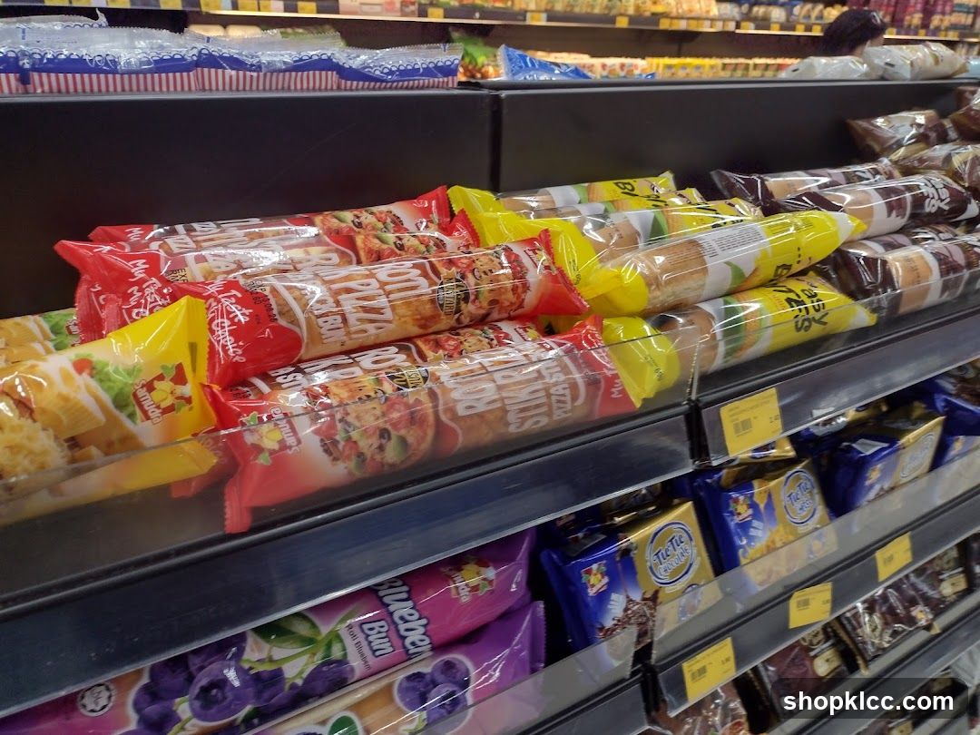 Packaged Snacks and Buns on Shelves