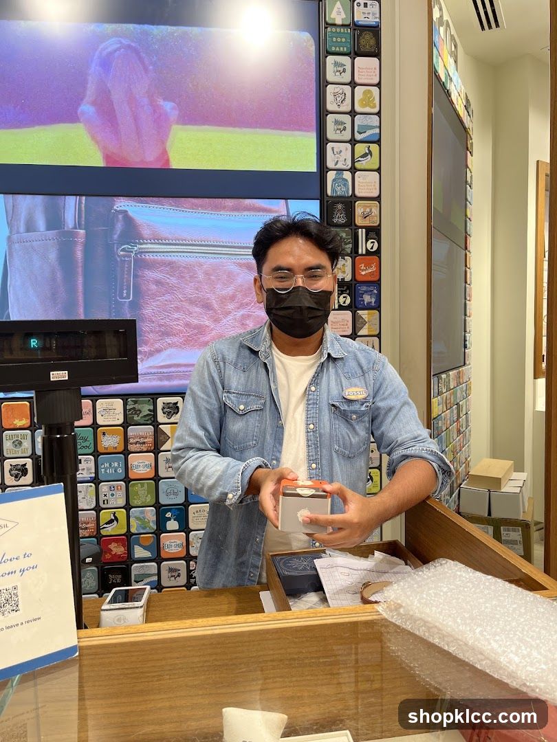 Man holding a Fossil product