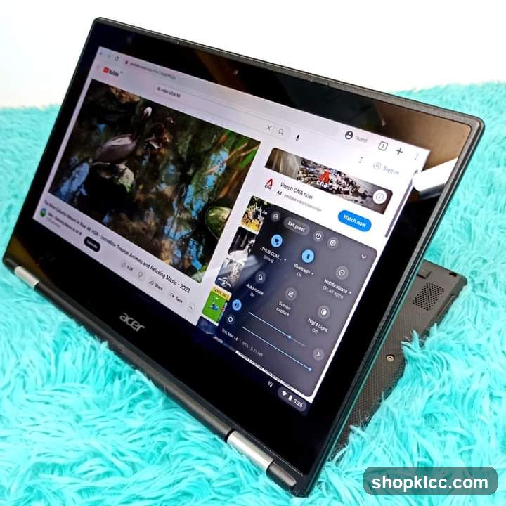 Acer Laptop on Blue Fuzzy Surface