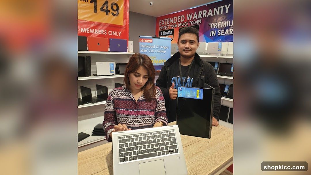 Laptop Store Interior with Staff and Products