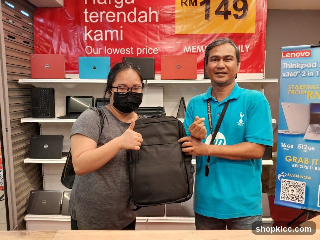 Laptop Store Interior with Staff and Customer
