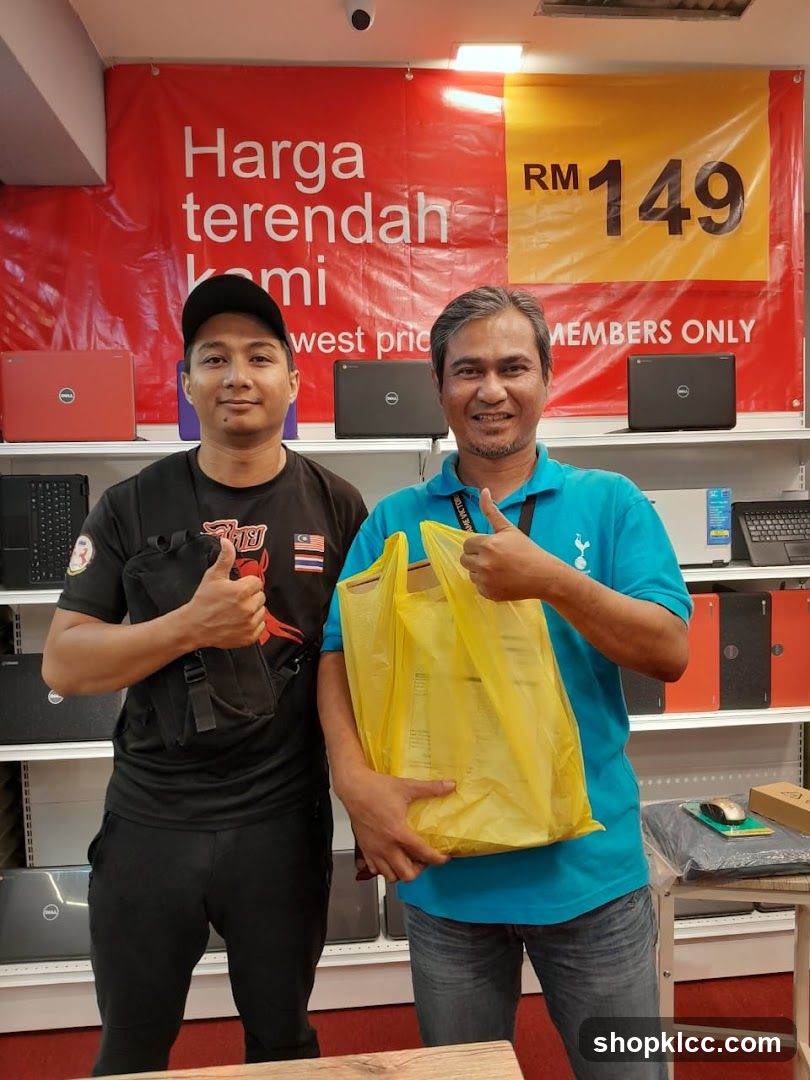 Laptop Store Interior with Staff and Customers