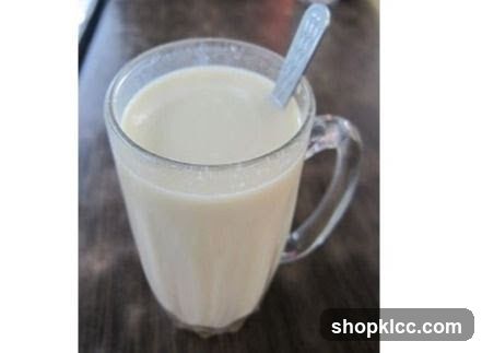 Glass of Milk with Spoon