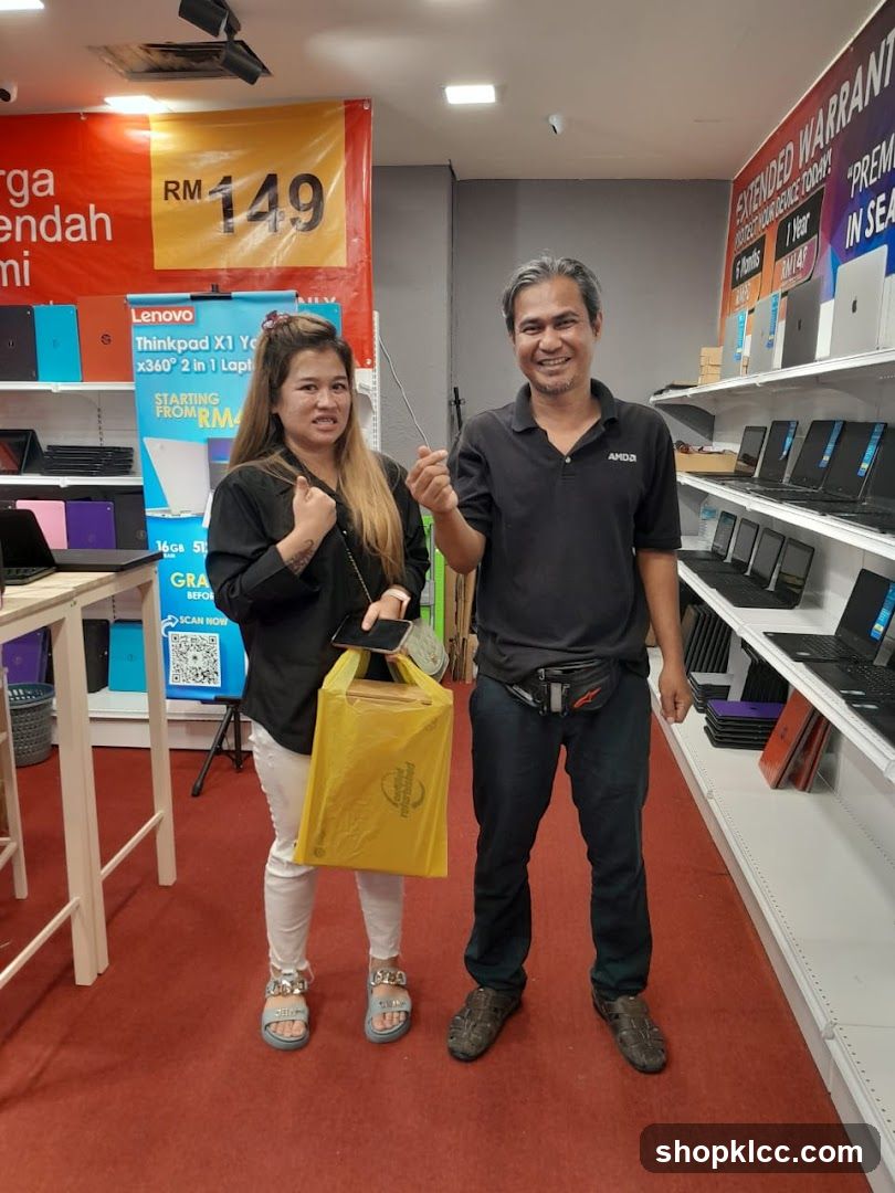 Electronics Store Interior with Staff and Customer