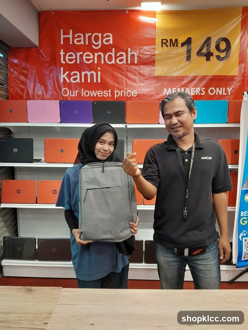 Laptop Store Interior with Staff and Product Display