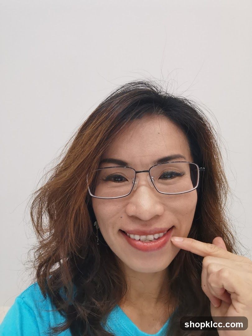 Woman pointing at her teeth