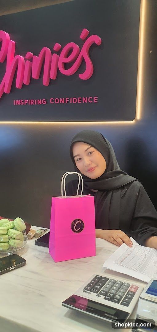 Woman with pink gift bag