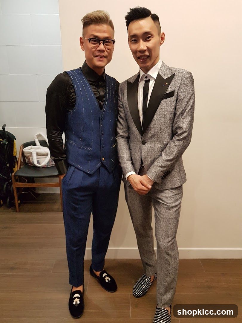 Two men in formal attire posing indoors