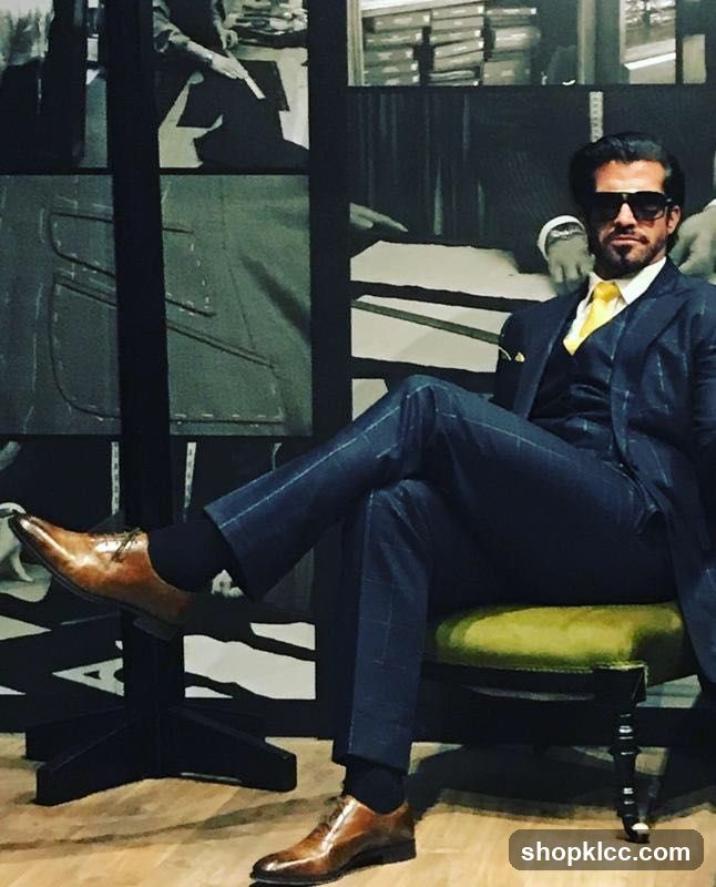 Man in Suit Sitting on Chair