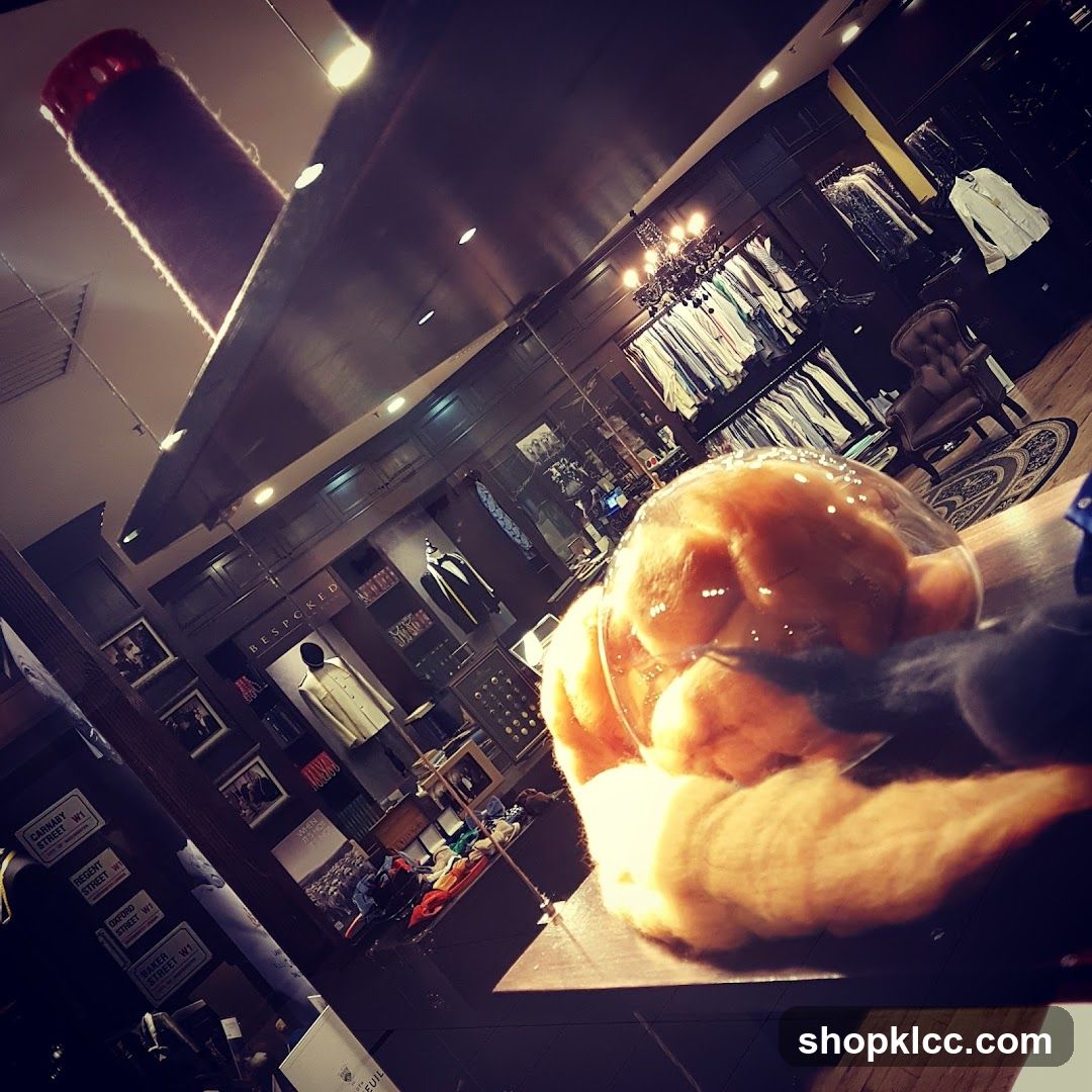 Interior of a clothing store with a close-up of food in the foreground