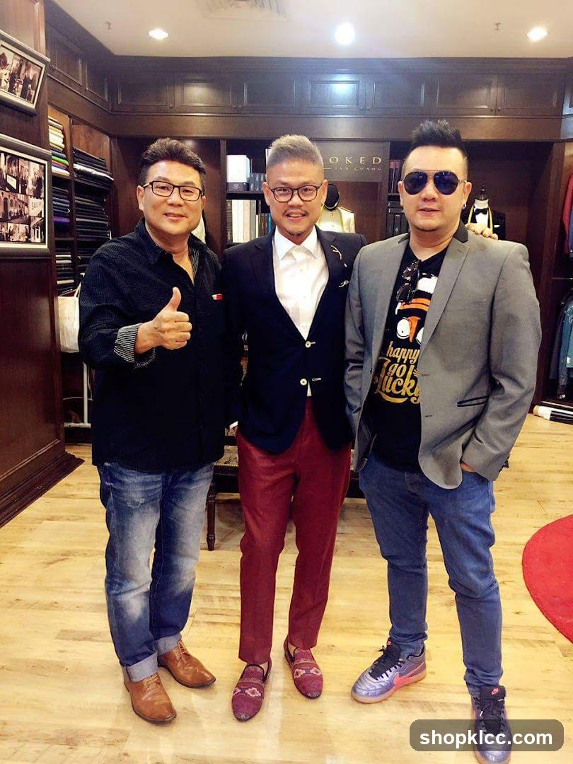 Three men posing in a clothing store interior