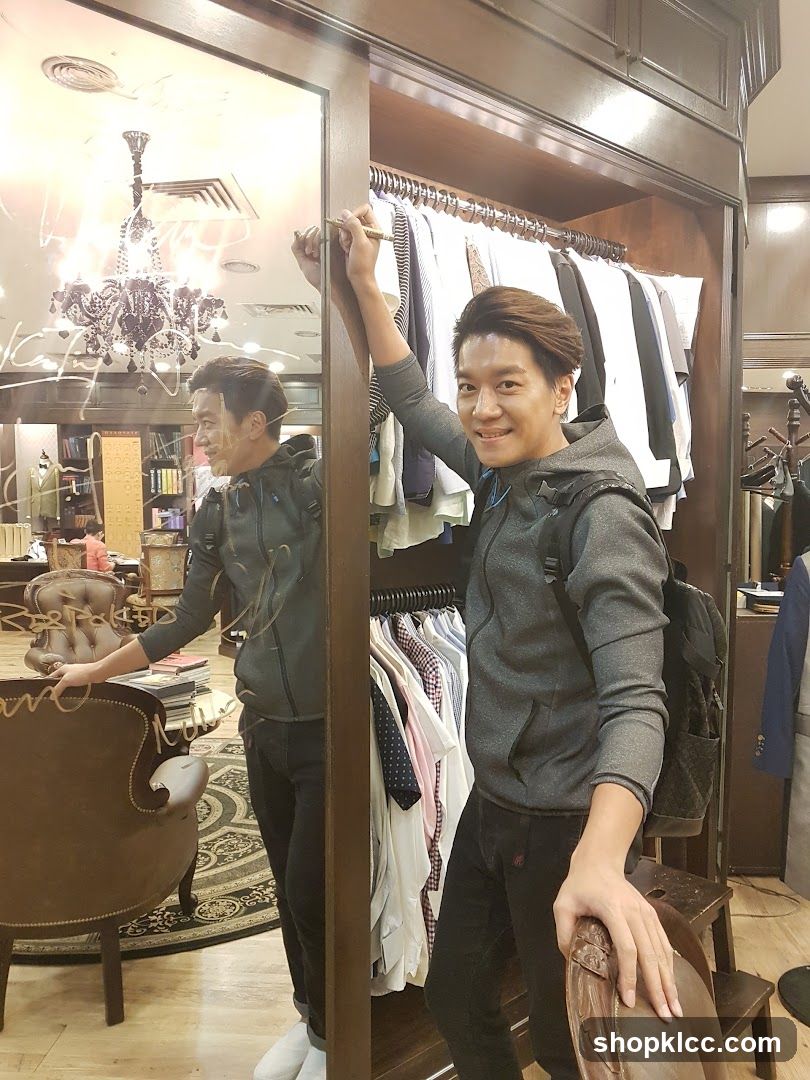 Man in Clothing Store Interior