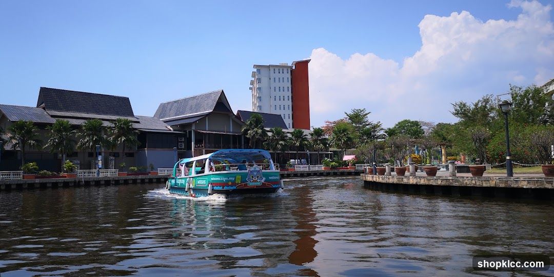 Boat on canal with buildings in background