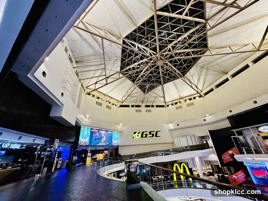Interior of a shopping mall with a large screen and GSC logo