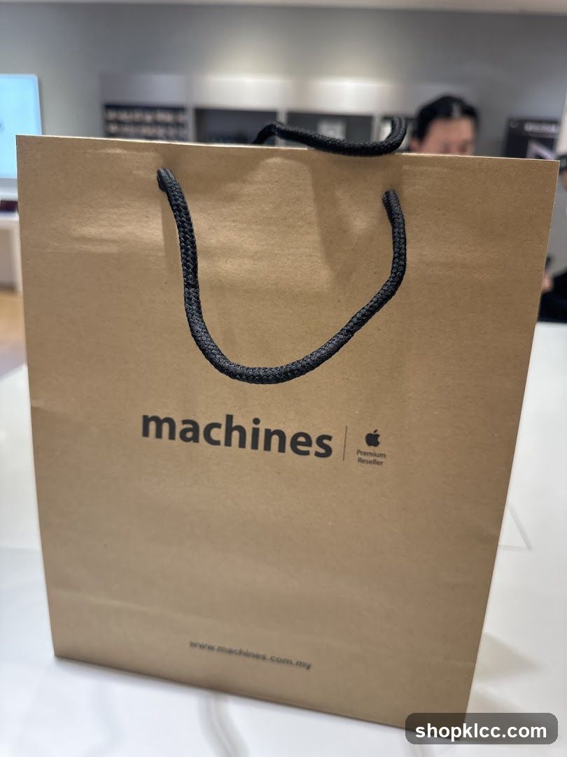 Brown paper shopping bag with "machines" logo