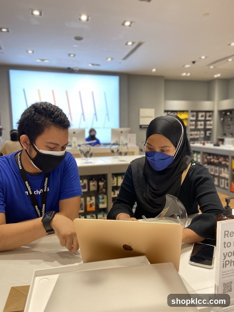 Store employees assisting a customer