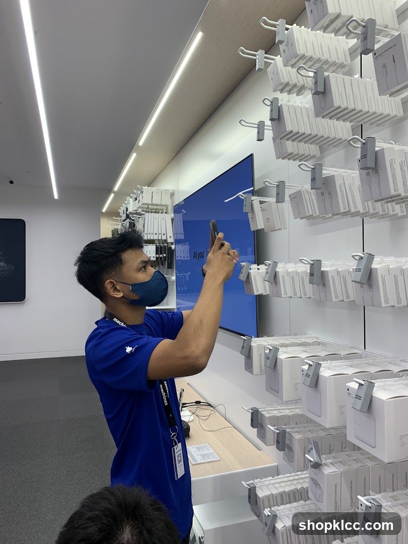 Store employee arranging products