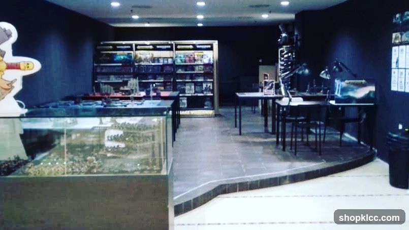 Hobby store interior with display cases and tables