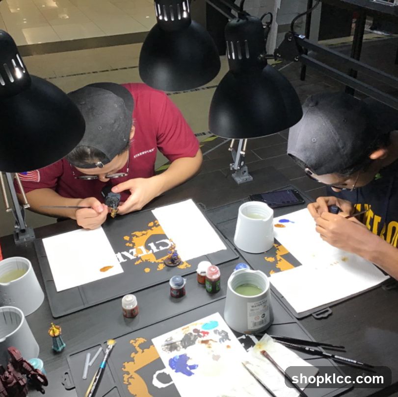 Hobbyists painting miniatures
