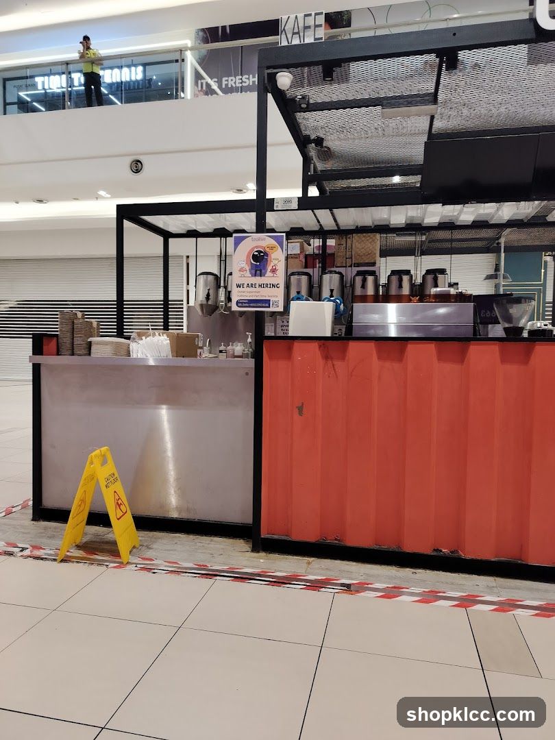 Coffee stand with hiring sign