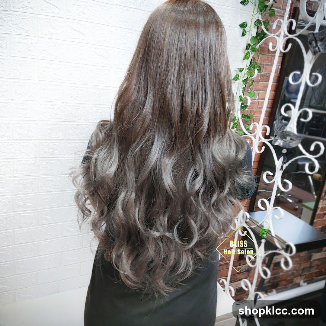 Woman with long, wavy, ash-brown hair