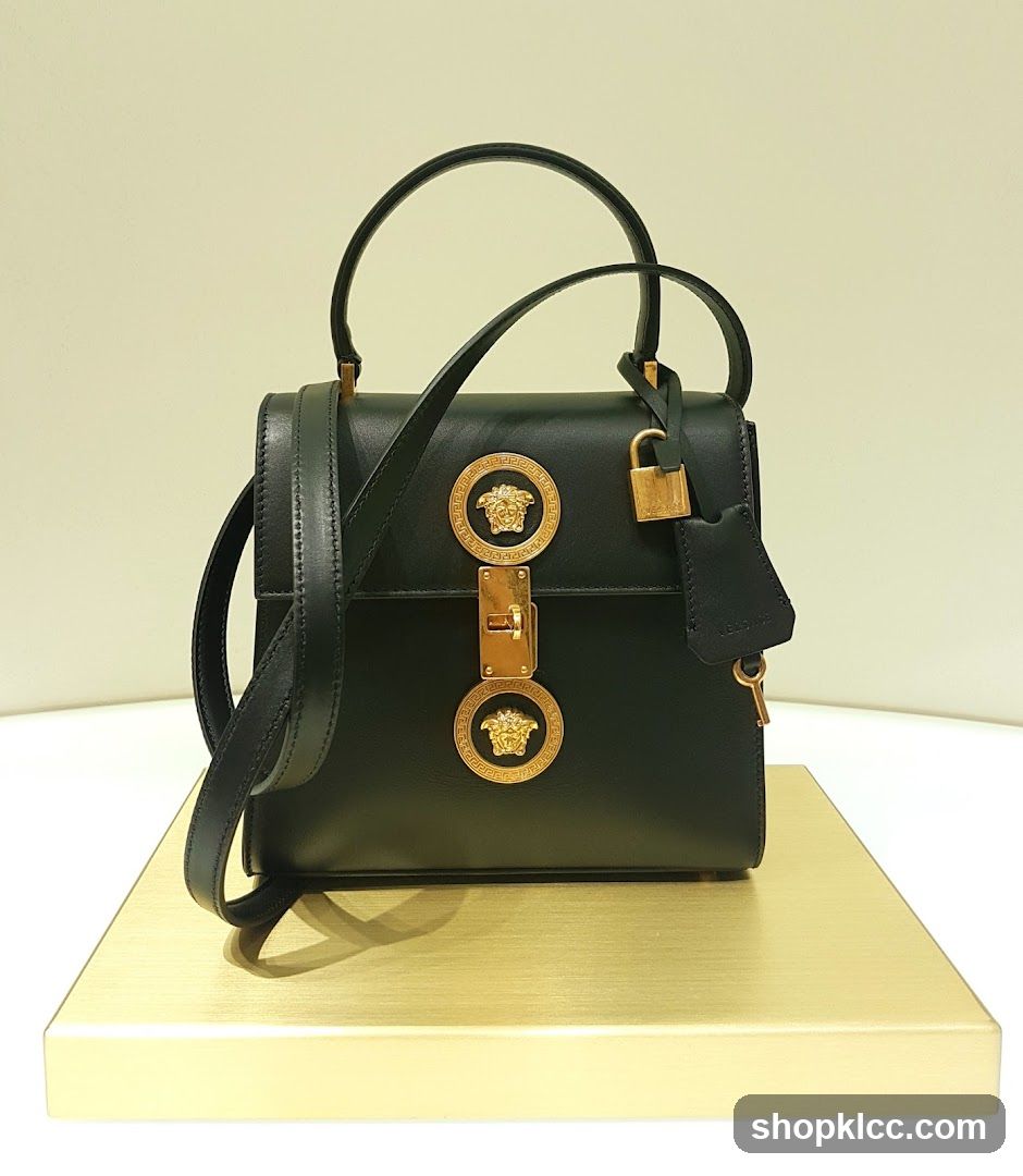 Black Leather Handbag with Gold Medusa Embellishments
