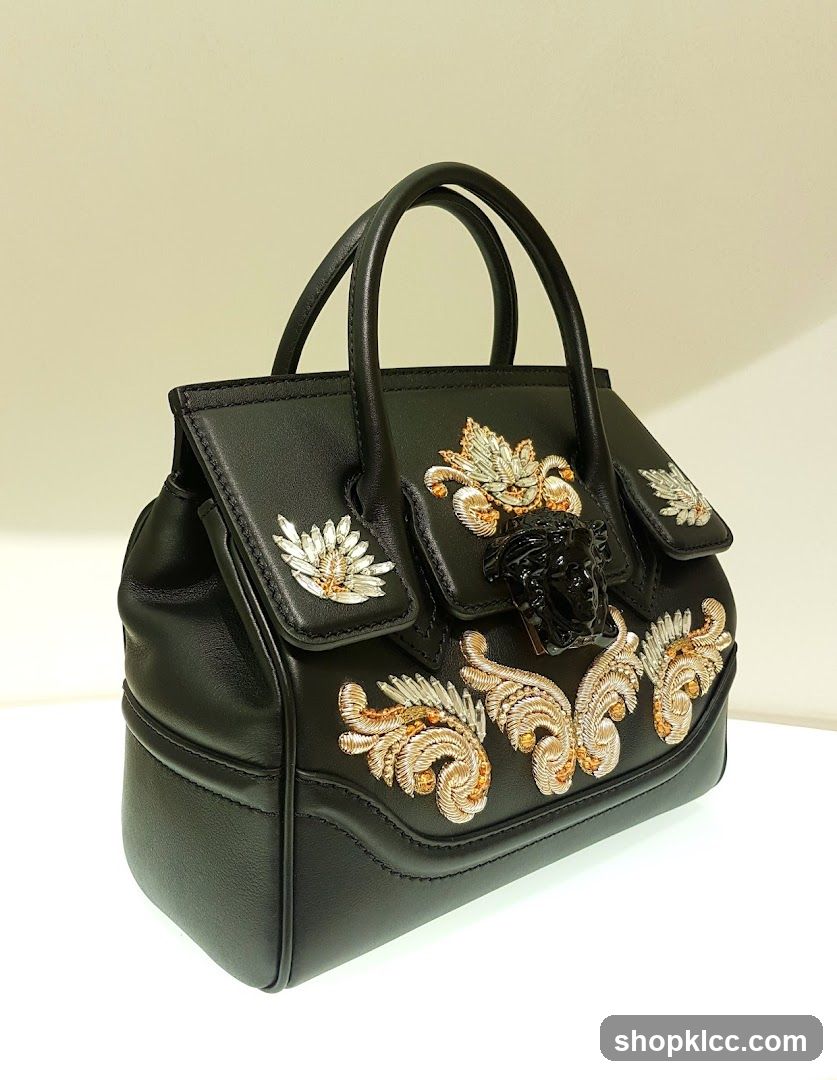 Black Leather Handbag with Medusa Head Embellishment