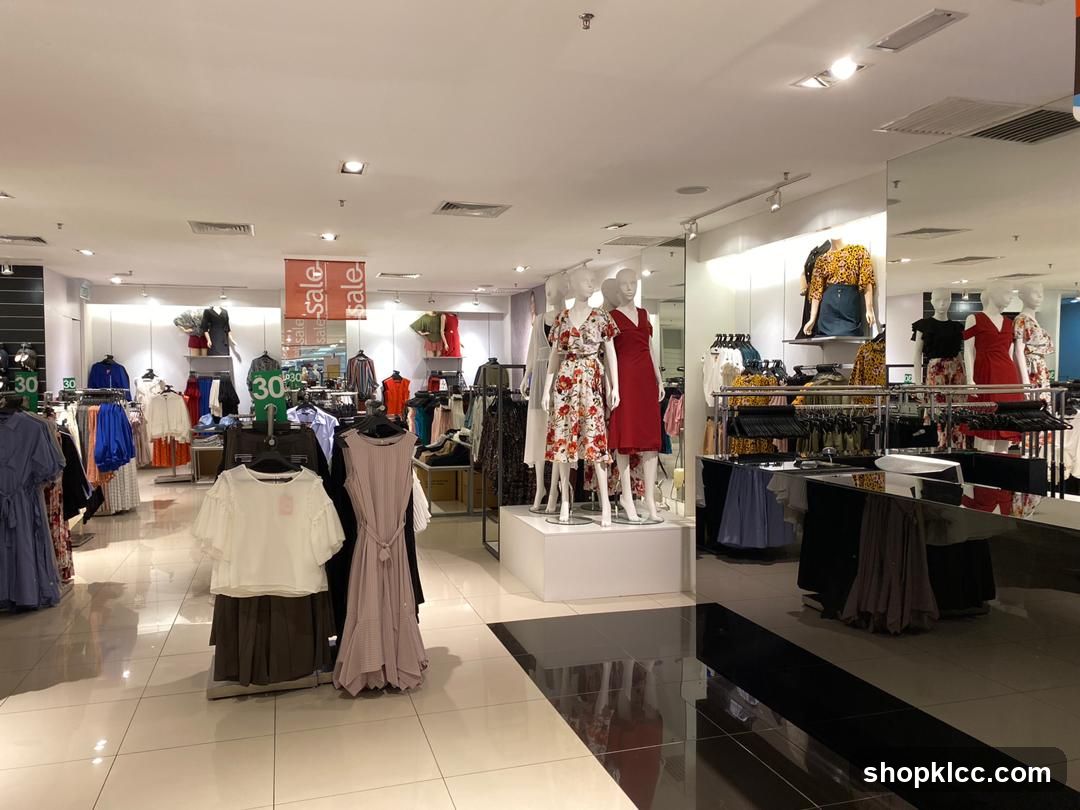 Clothing store interior with mannequins and sale signs