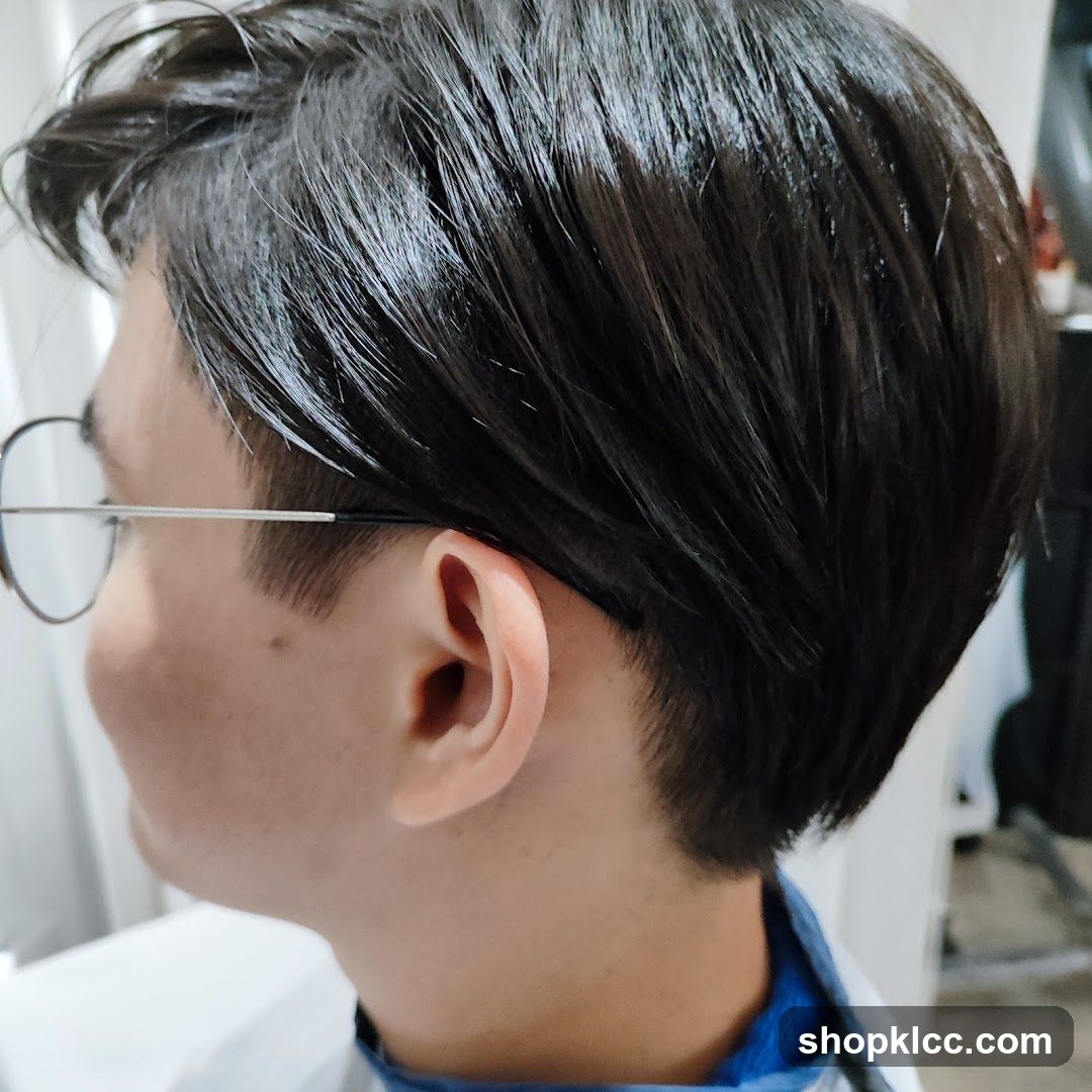 Close-up of a person's ear and hair