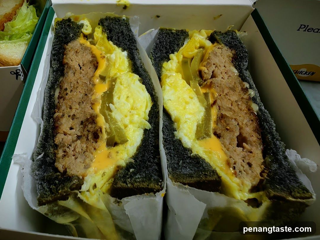 Sandwich with Meat Patty and Scrambled Eggs