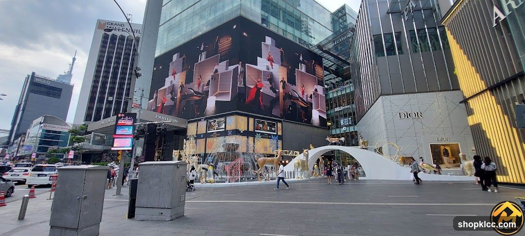 City Street with Large Digital Billboard and Dior Storefront