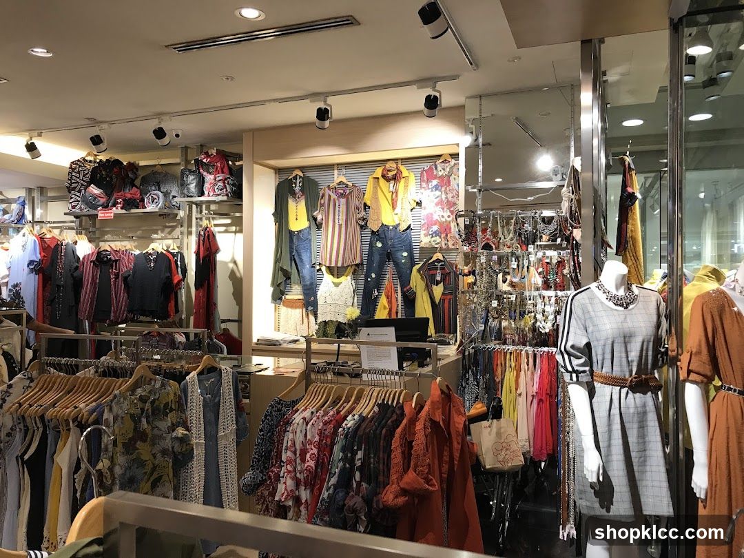 Clothing store interior with mannequins and apparel
