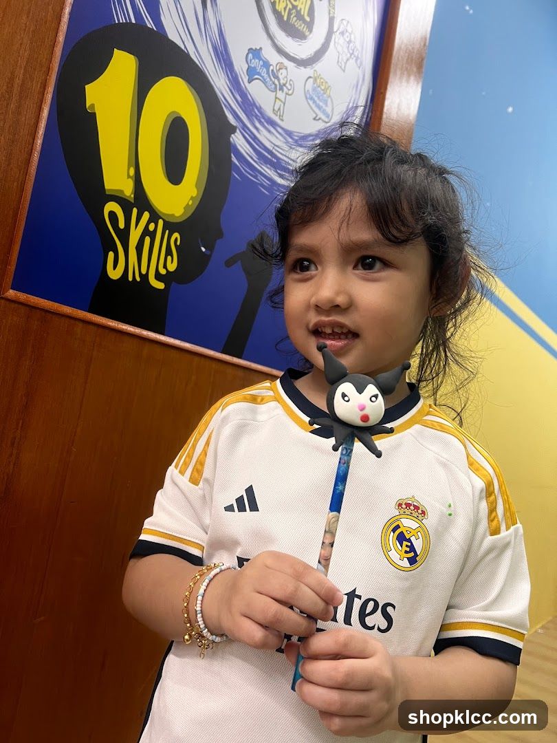 Child with a wand and a poster