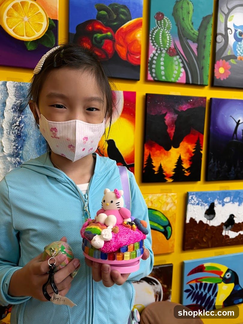 Girl with Hello Kitty craft