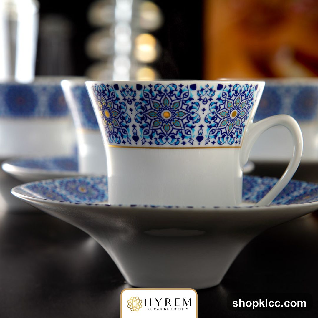 Coffee cups with intricate blue and gold patterns