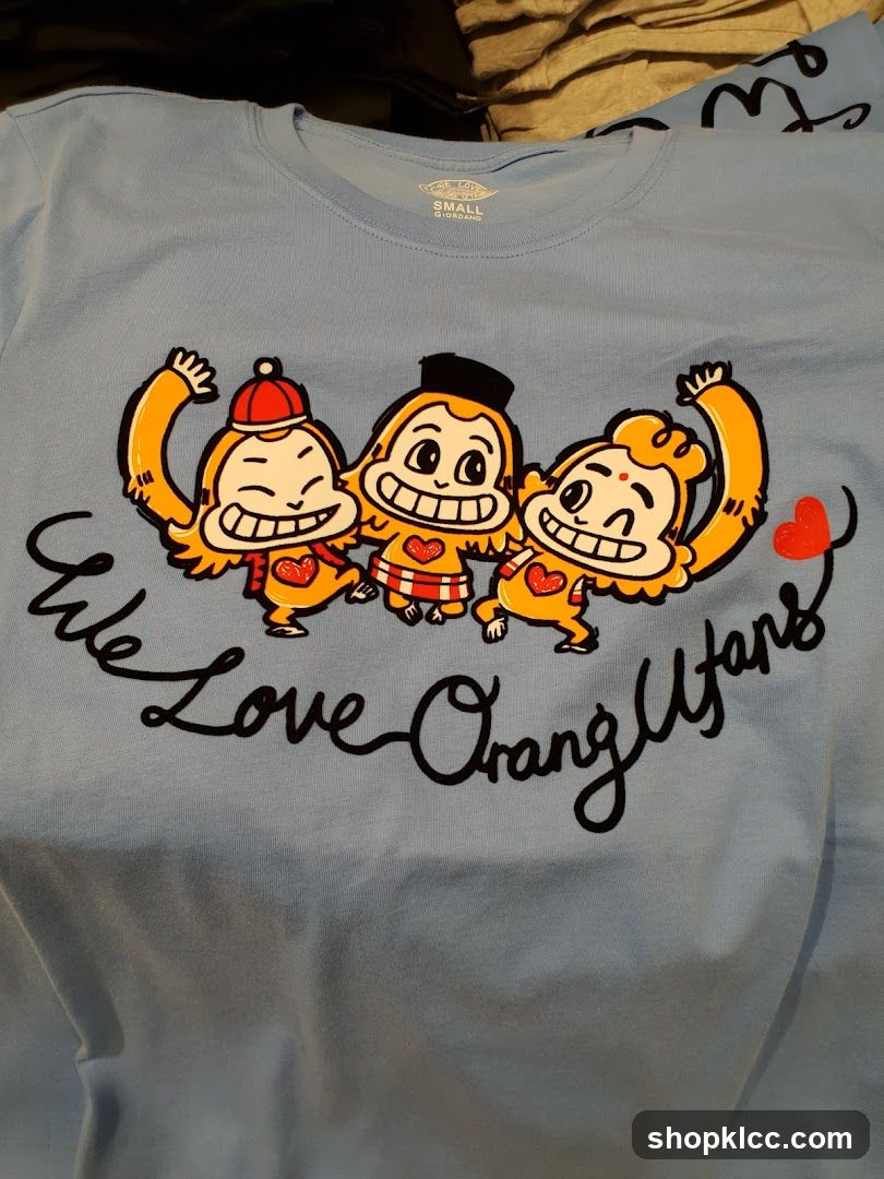 Light Blue T-Shirt with Cartoon Monkeys