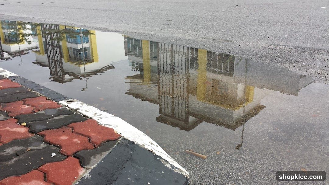Reflection of a building in a puddle