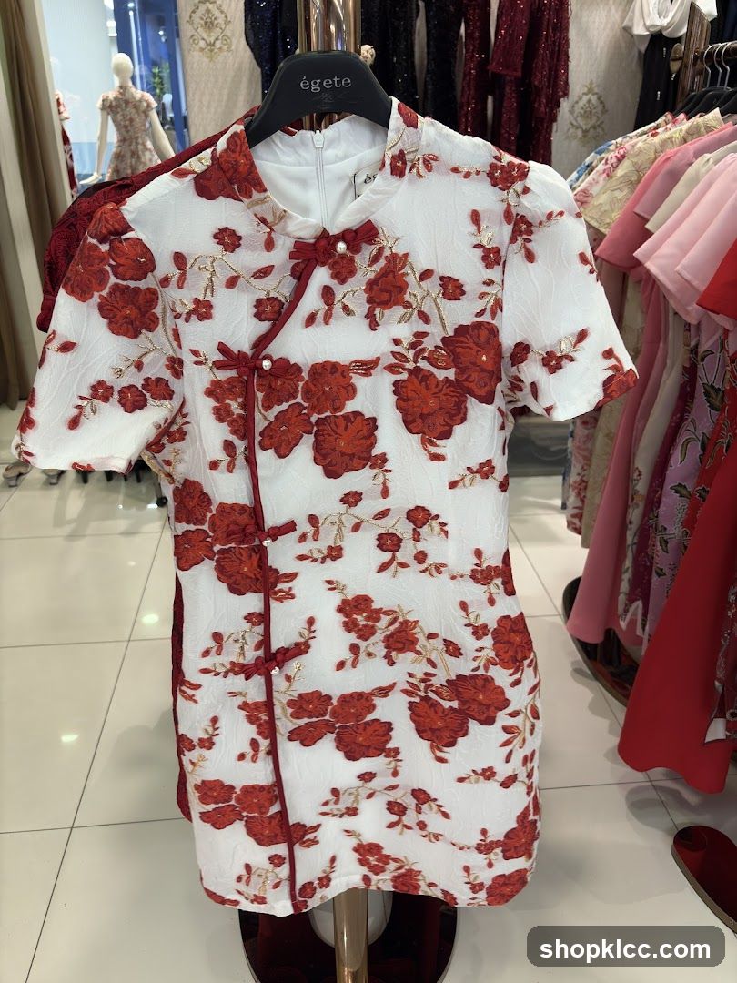 White dress with red floral pattern