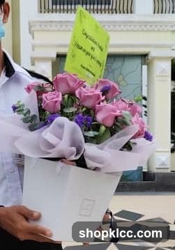Flower bouquet with congratulatory card