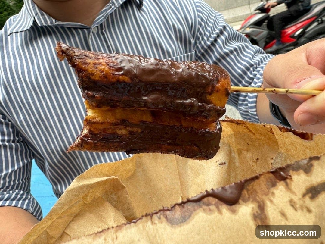 Chocolate-covered pastry on a skewer
