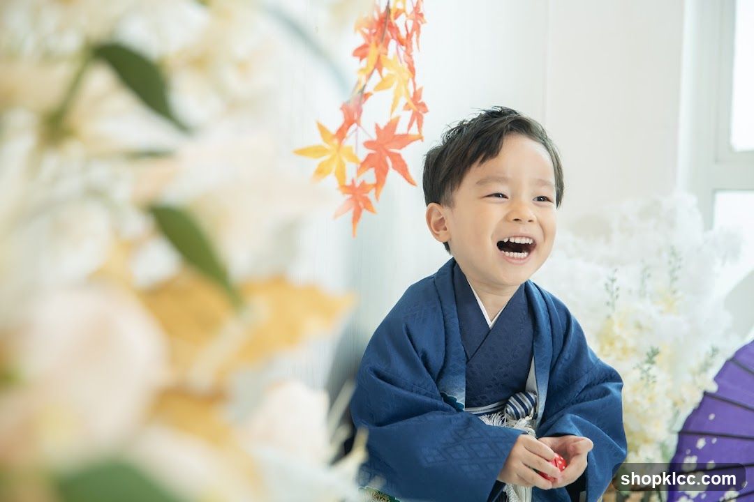 Young boy in traditional Japanese attire laughing