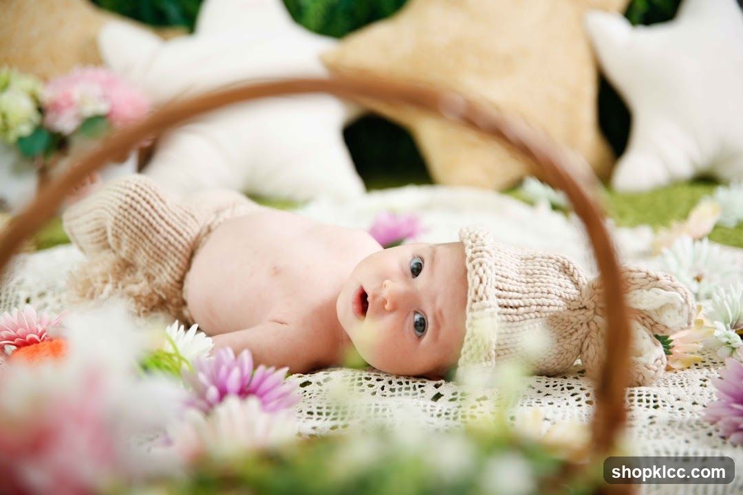 Baby in a basket with flowers