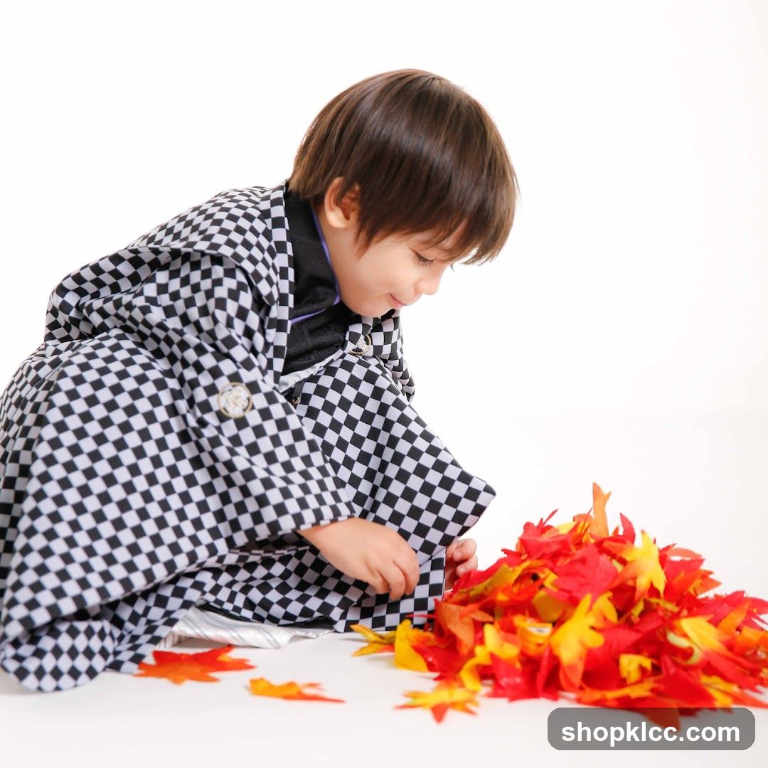 Boy in Kimono with Autumn Leaves