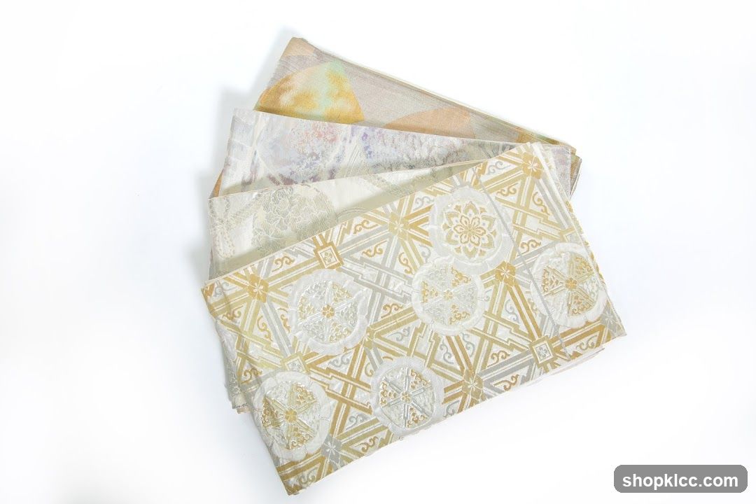 Four folded fabrics with intricate patterns