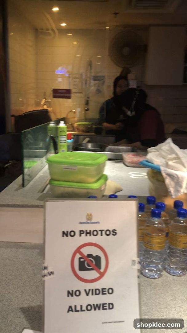 No Photos or Videos Allowed Sign