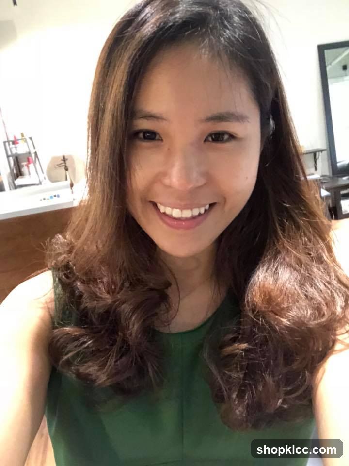 Woman with wavy hair smiling in a salon or beauty shop interior