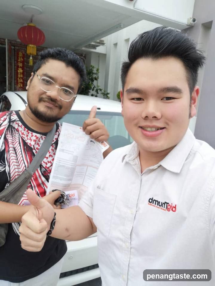 Two men giving thumbs up