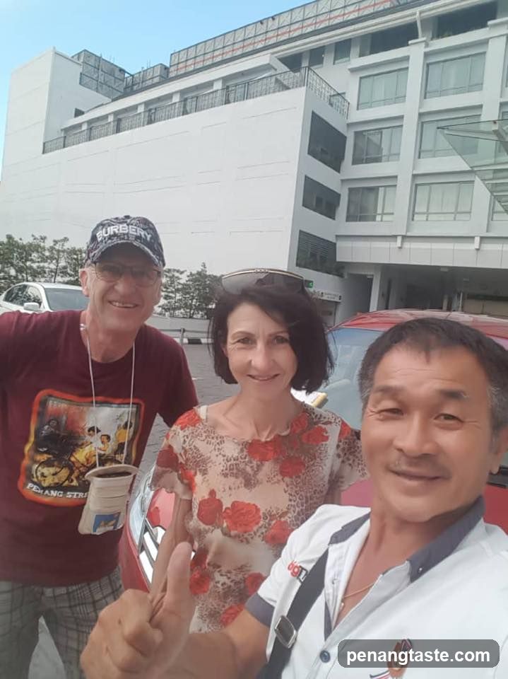 Three people posing for a selfie in front of a building