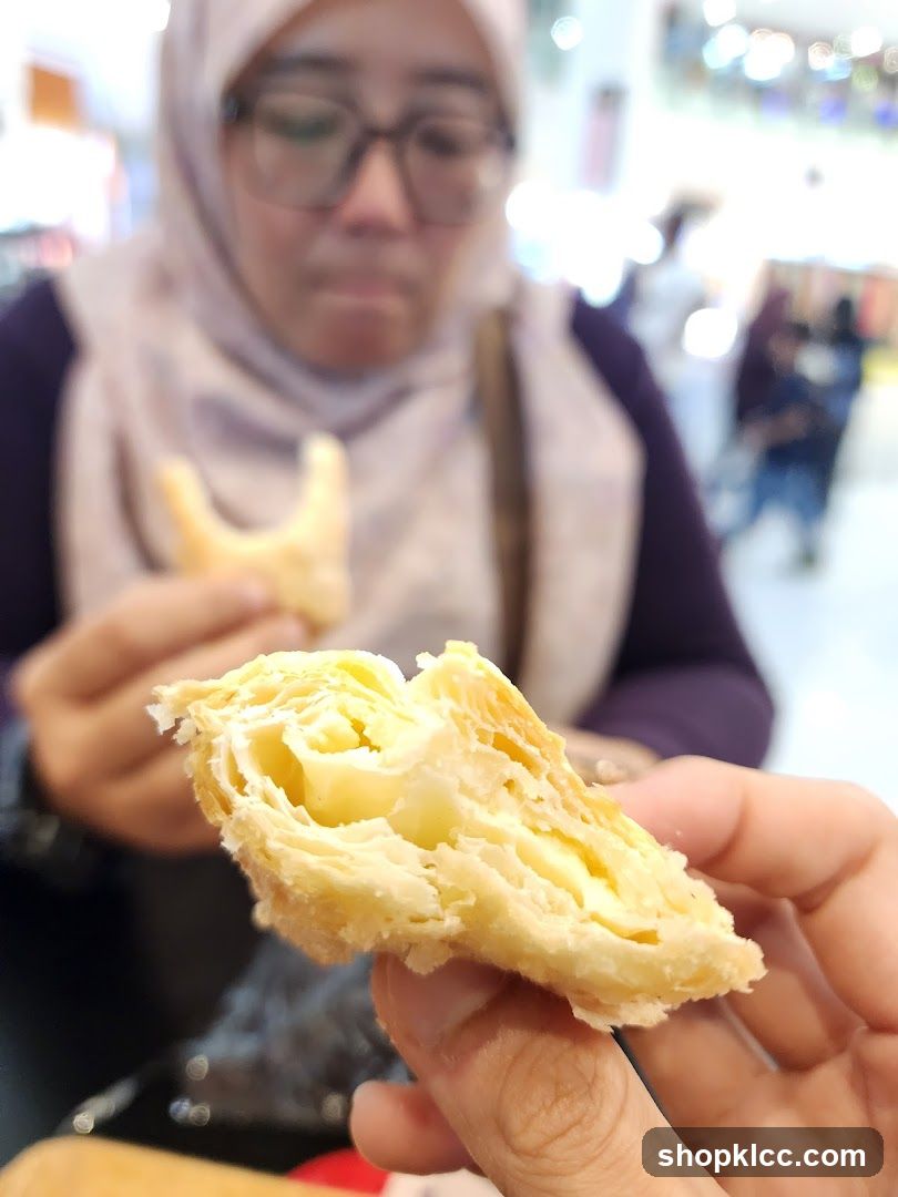 Person holding a pastry