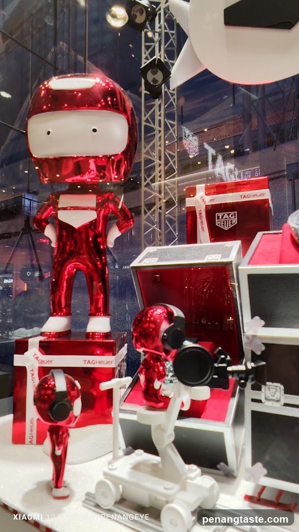 Window Display with Red Figures